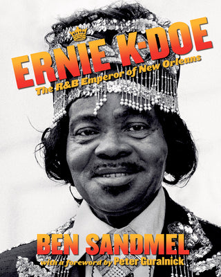A book cover featuring a black and white photograph of Ernie K-Doe with a crown and smiling, titled 'Ernie K-Doe: The R&B Emperor of New Orleans' by Ben Sandmel with a foreword by Peter Guralnick.