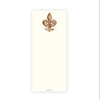 A tall, narrow cream-colored notepad featuring a decorative brown fleur-de-lis emblem near the top center, shown on a plain white background.
